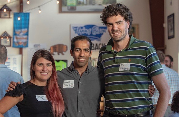 Three Next Generation United Members at an event.